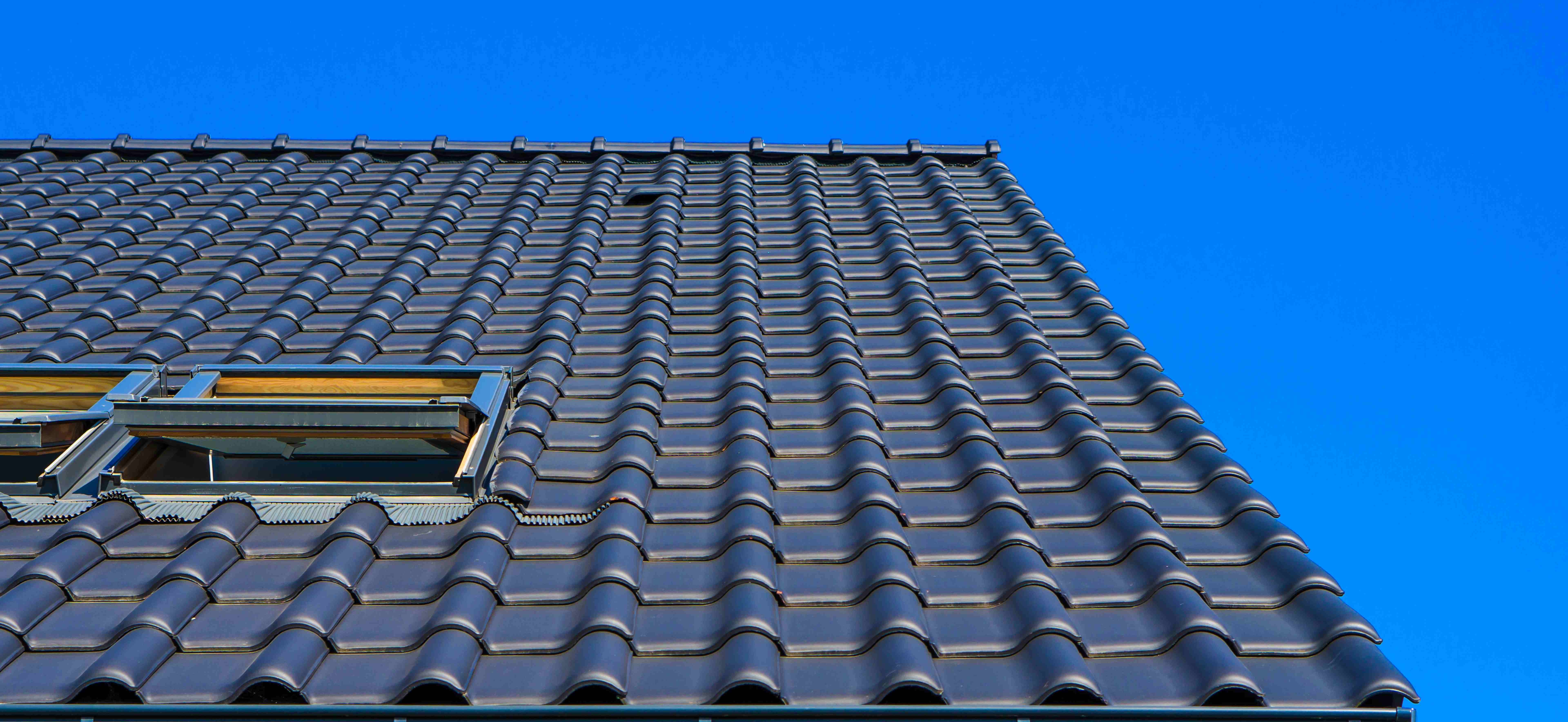Close-up of premium quality roofing tiles against blue sky